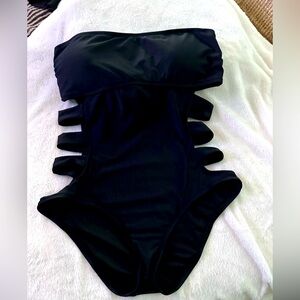 Black strapless cut-out one piece bathing suit